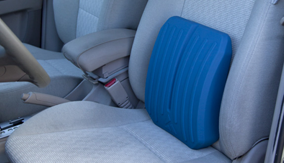 Core Restore cushion supporting the lower back against a car seat