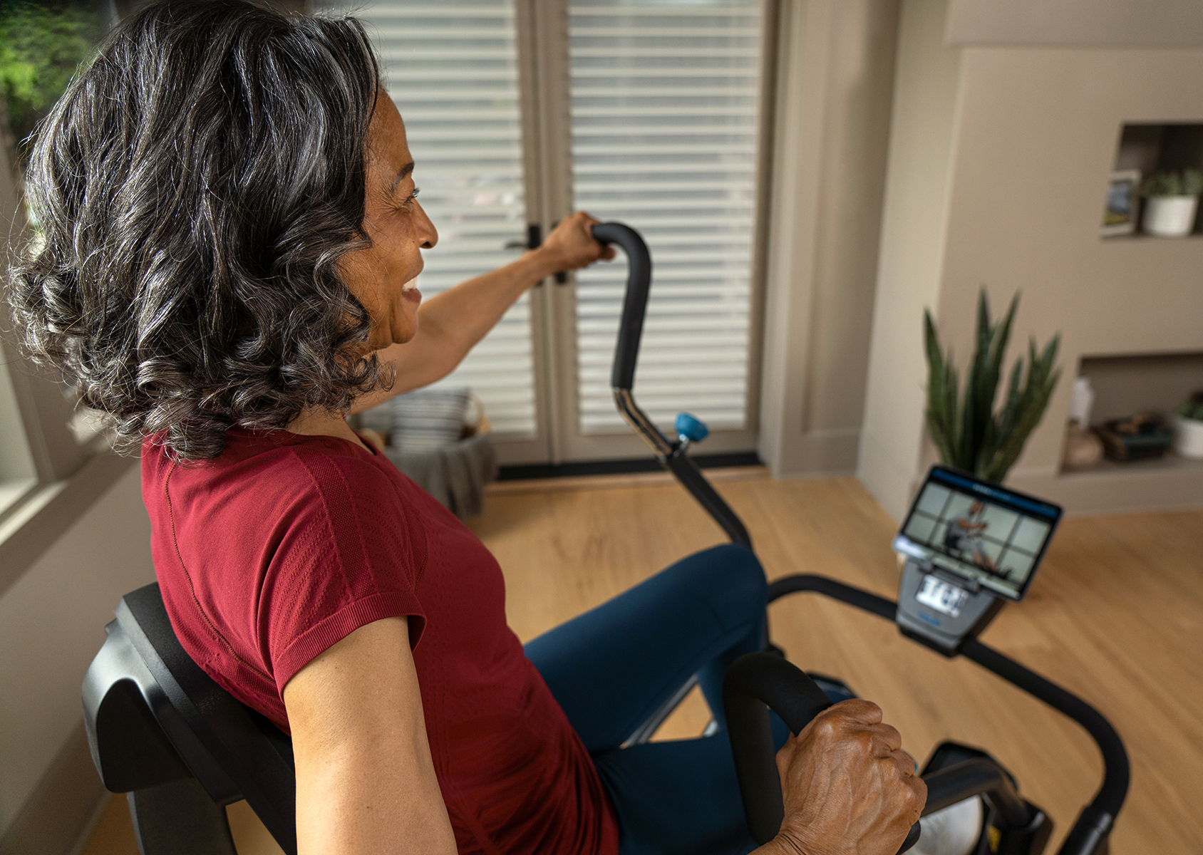 Woman Working Out on FreeStep Cross Trainer with Teeter Move App